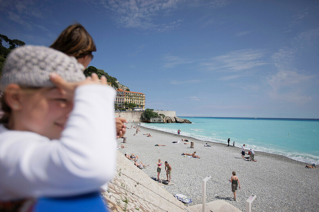 Young girl at the city beach in Nice, Cote d'Azur, Provence, France