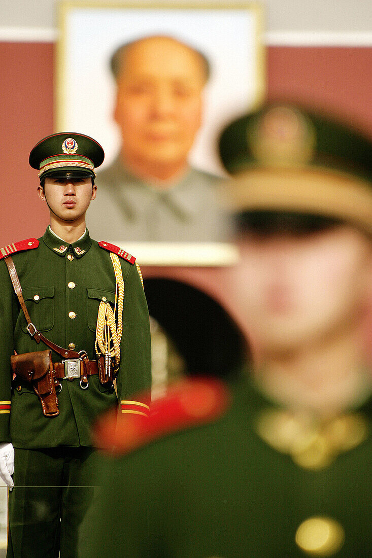Chinese soldiers guard the Tiananmen Square with the Gate of Heavenly Peace in the background, Beijing, China