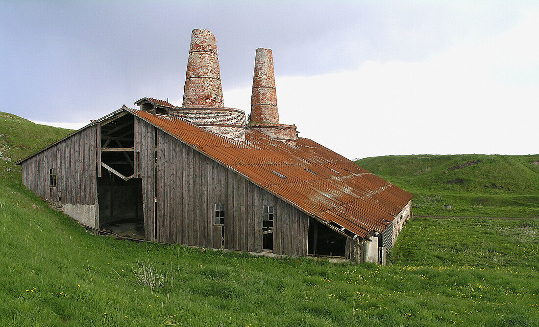 view of the bjorndal chalkworks on thyholm, western Jutland Denmark. Chalk was mined near by, and burned at the factory, and used for plaster and motar. The wors are not used any more, adn are more or les in ruins.