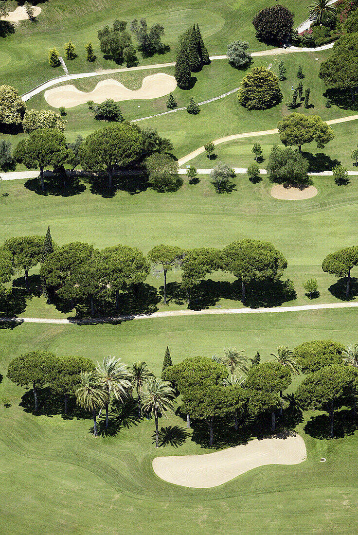 Aerial view, Aerial views, Color, Colour, Contemporary, Daytime, Exterior, Golf, Golf course, Golf courses, Green, Nature, Outdoor, Outdoors, Outside, Sport, Sports, Tree, Trees, Vegetation, View from above, S73-489071, agefotostock