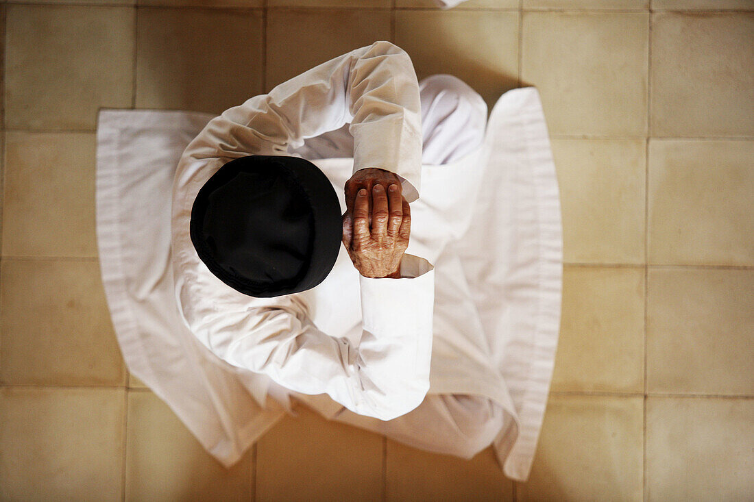 Monk praying. Cao Dai religion. Long Hoa. Vietnam