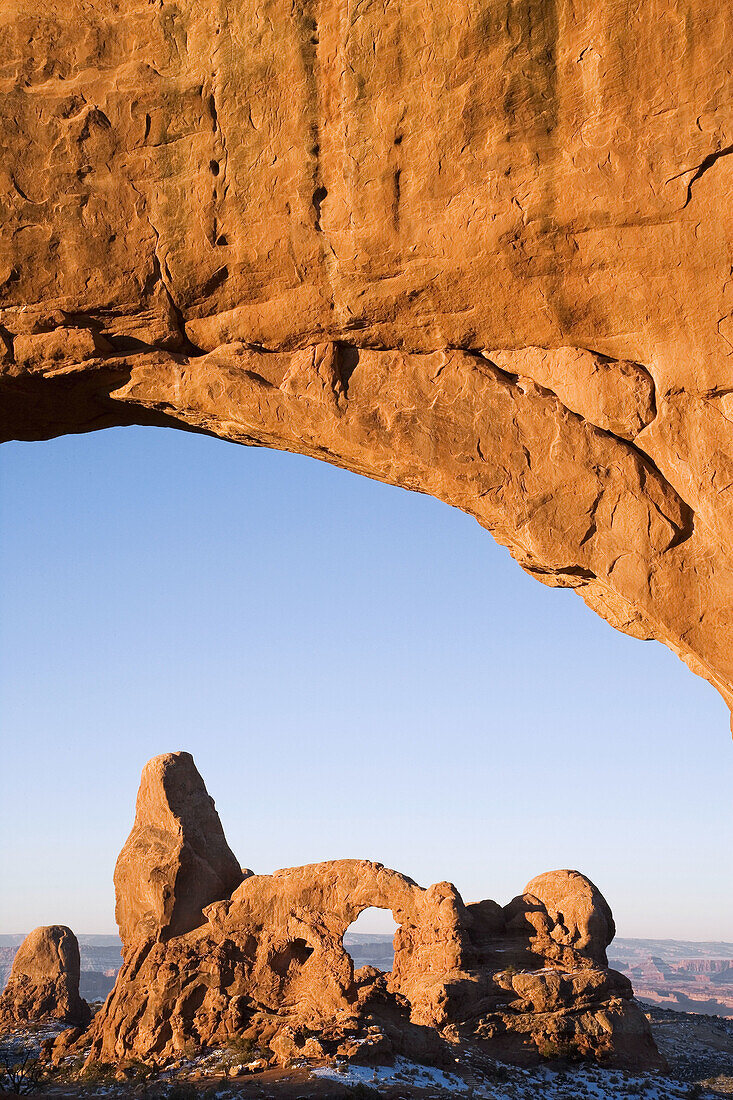Turret Arch framed through North Window at sunrise, Arches National Park, Utah, USA.