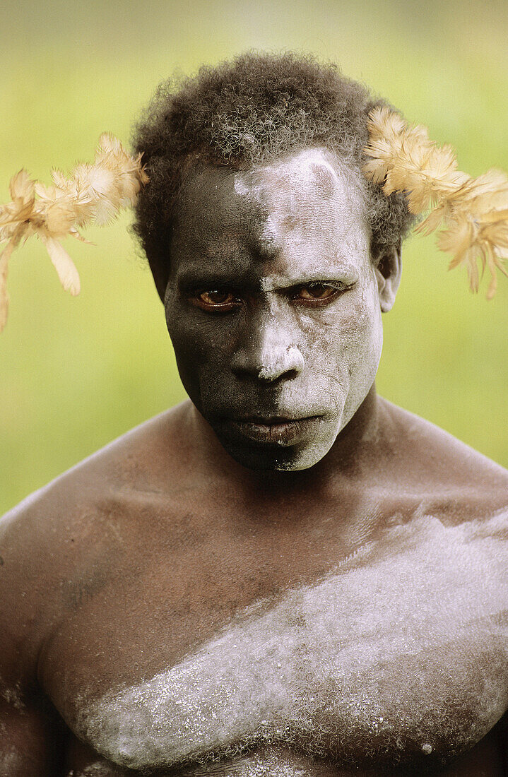 Portrait of an Asmat man with painted face, Western Papuasia, Former Irian-Jaya, Indonesia