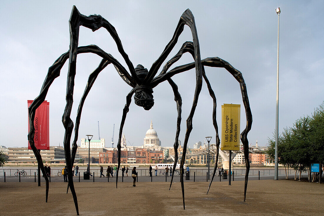 Sculpture of a huge spider by Louise Bourgeois in front of Tate Modern, St. Paul's Cathedral in the background, London, England, Europe