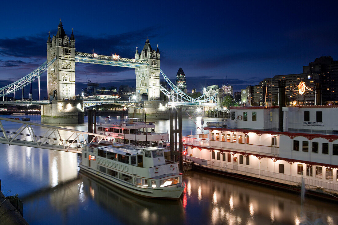 Boats on the River Themes at night, Tower Bridge in the background, London, England, Europe