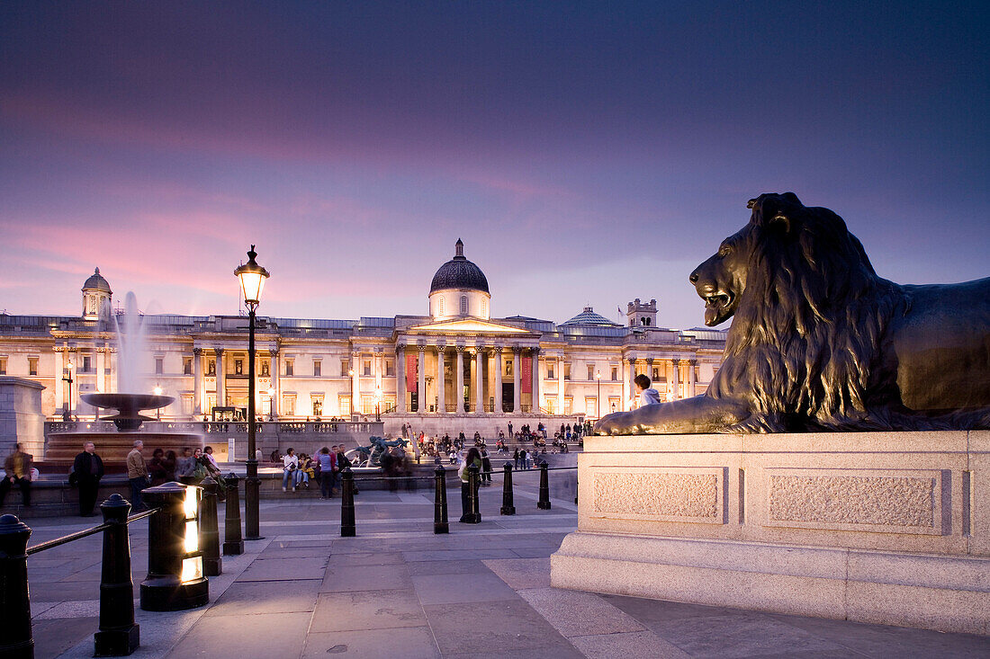 Trafalgar Square with lion statue and National Gallery, London, England, Europe