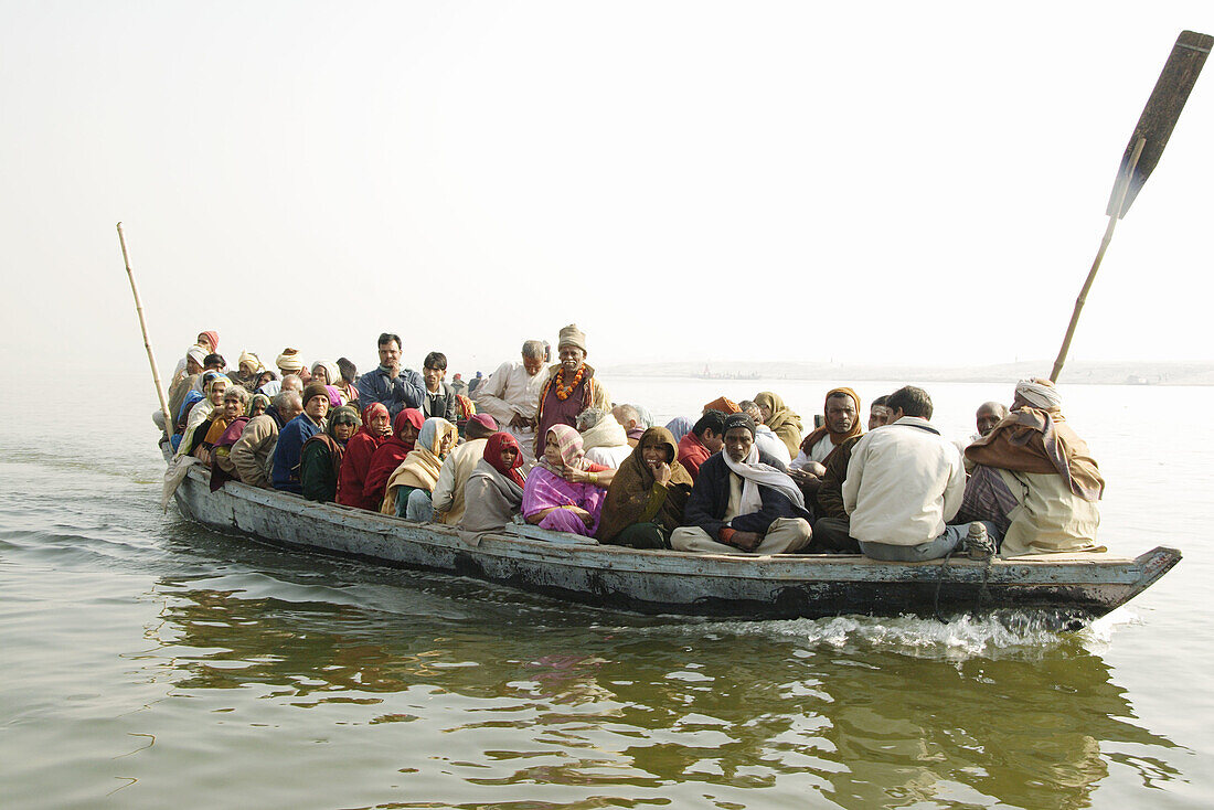 Boat with people on Ganges (Ganga), Varanasi (Benares, Benaras, Banaras), Hindu holy city, state Uttar Pradesh, India