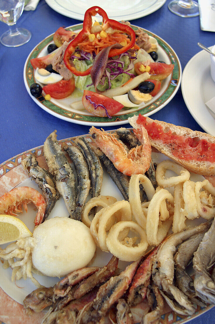 Fried fish and seafood with salad