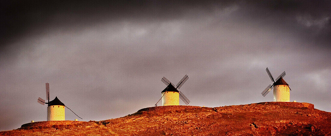 Windmills in evening light, Consuegra. Toledo province, Castilla-La Mancha, Spain