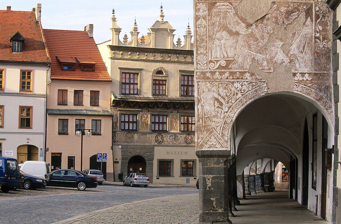 Prachitace Market Place with houses from Renaissance style and sgraffito paintings. Arcades, Bohemia. Czech Republic.