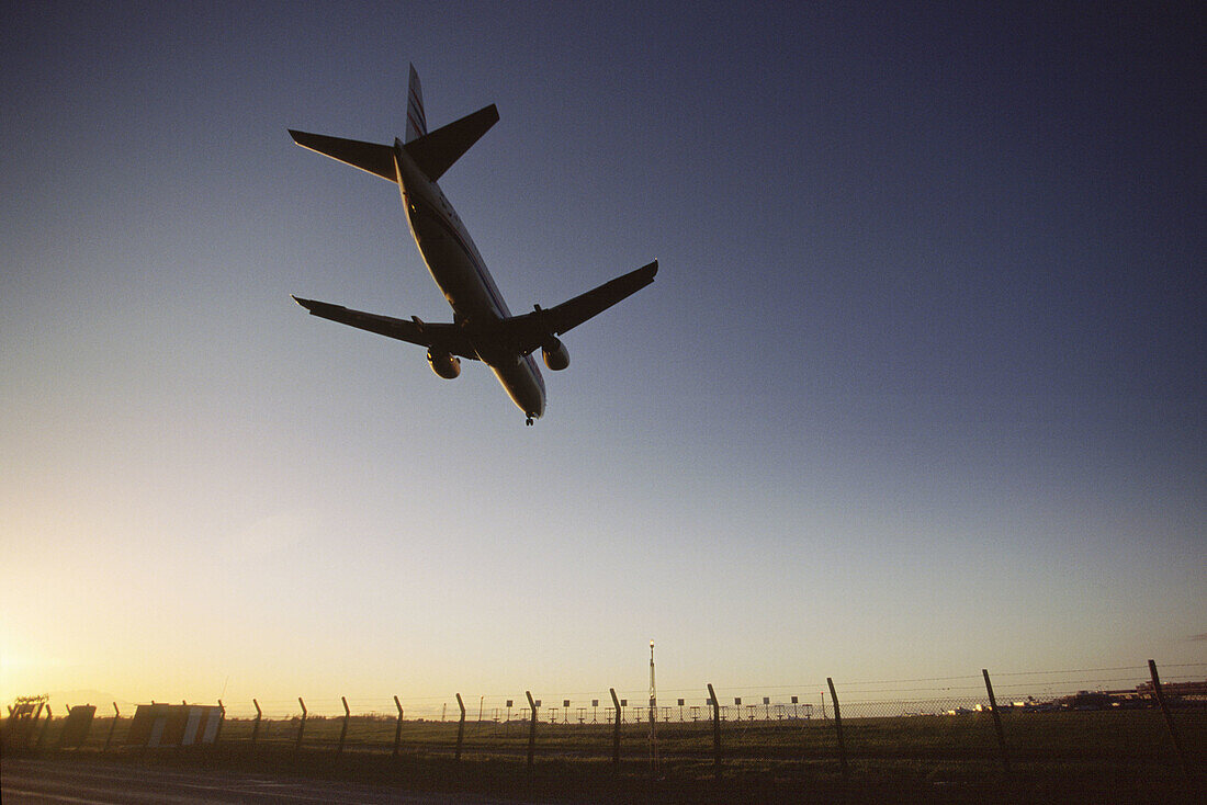 CSA airbus A320 landing at Dublin airport on runway 34 at sunset