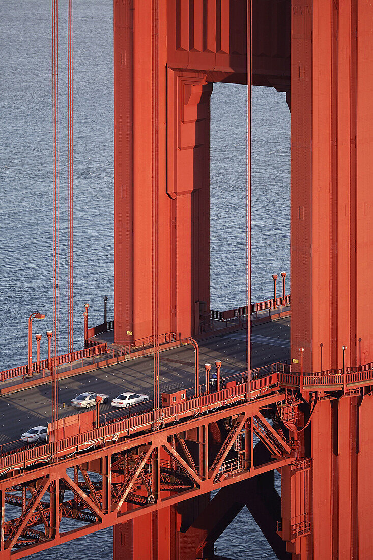 Detail of the bridge deck and tower of the Golden Gate Bridge, San Francisco, California, United States of America