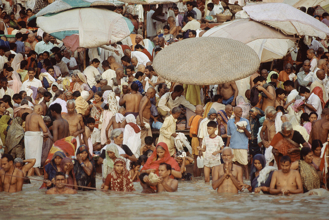 Ritual ablutions in Dasashvamedha ghat on Ganges river, Varanasi. Uttar Pradesh, India (October, 2005)