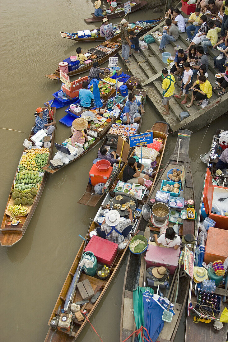 Floating Market southwest of Bangkok. Amphawa Floating Market. Vegetable vendors meet on canal in the afternoon every friday suterday and sunday