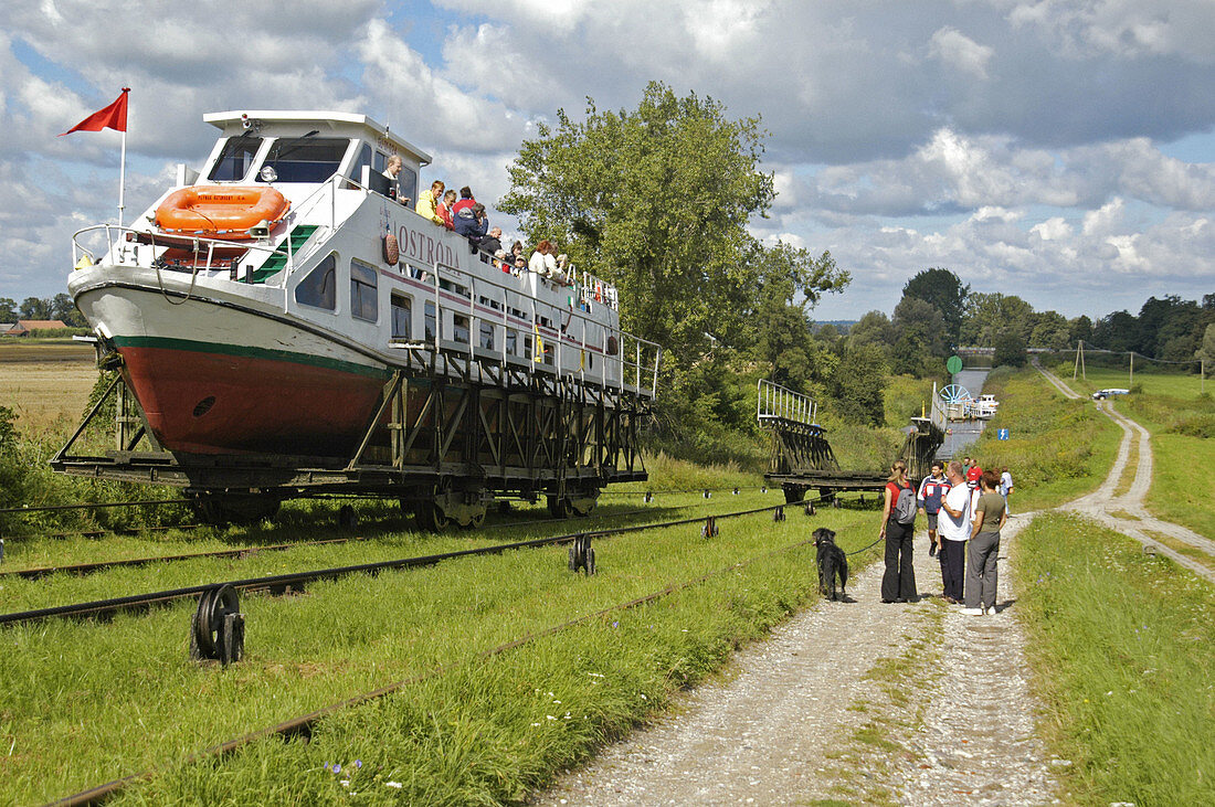 Boat on cable car being pulled uphill. Ostroda-Elblag Canal: Overland transportation of boats on rail cars at the Elblag Canal (Polish: Kanal Elblaskie, German: Oberlaendischer Kanal), Masuria, Poland, Europe
