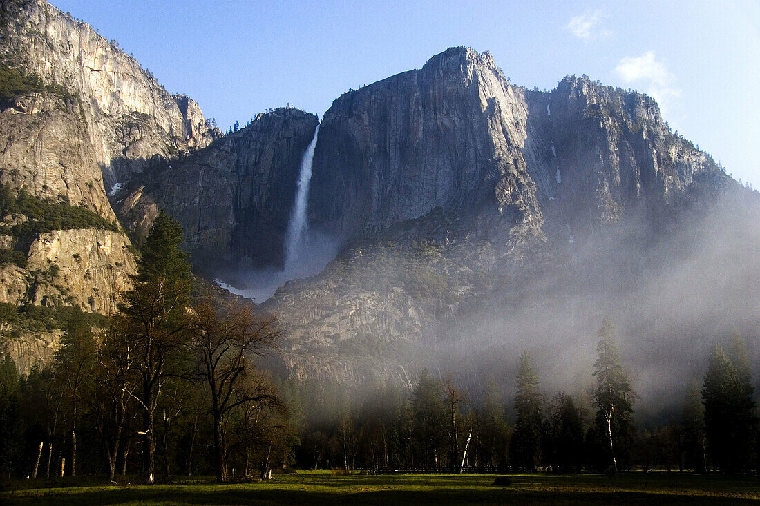 Upper Yosemite Falls as morning fog rises in Yosemite National Park, California. USA.