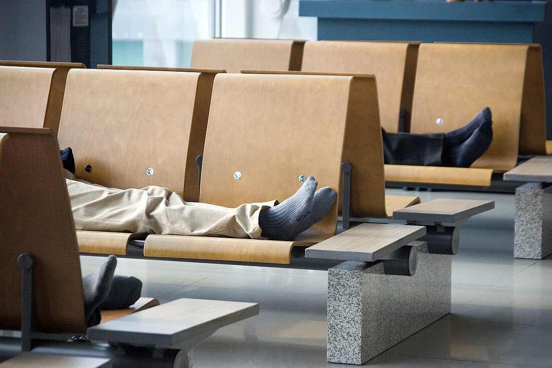 Men sleeping at airport, Incheon International Airport, South Korea
