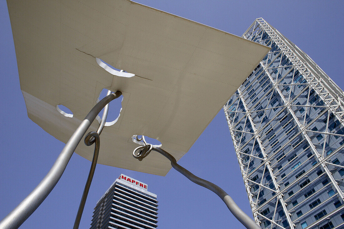 David and Goliath sculpture by Antoni Llena (1992), Mapfre tower and Hotel Arts, Plaça dels Voluntaris, Barcelona. Catalonia, Spain