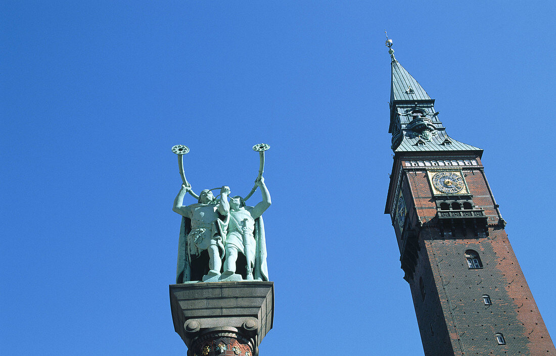 Lur blower statue and City Hall tower. Copenhagen. Denmark