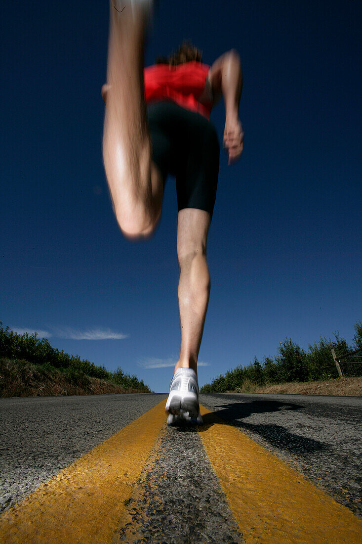 Runner, man running on a country road near Mount Hood, from Mount Hood to seaside, Oregon, model release