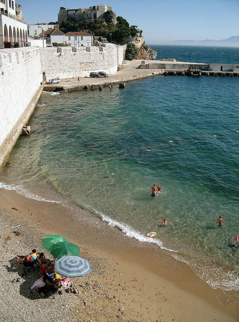 Small beach next to the sea defences of the town of Gibraltar.