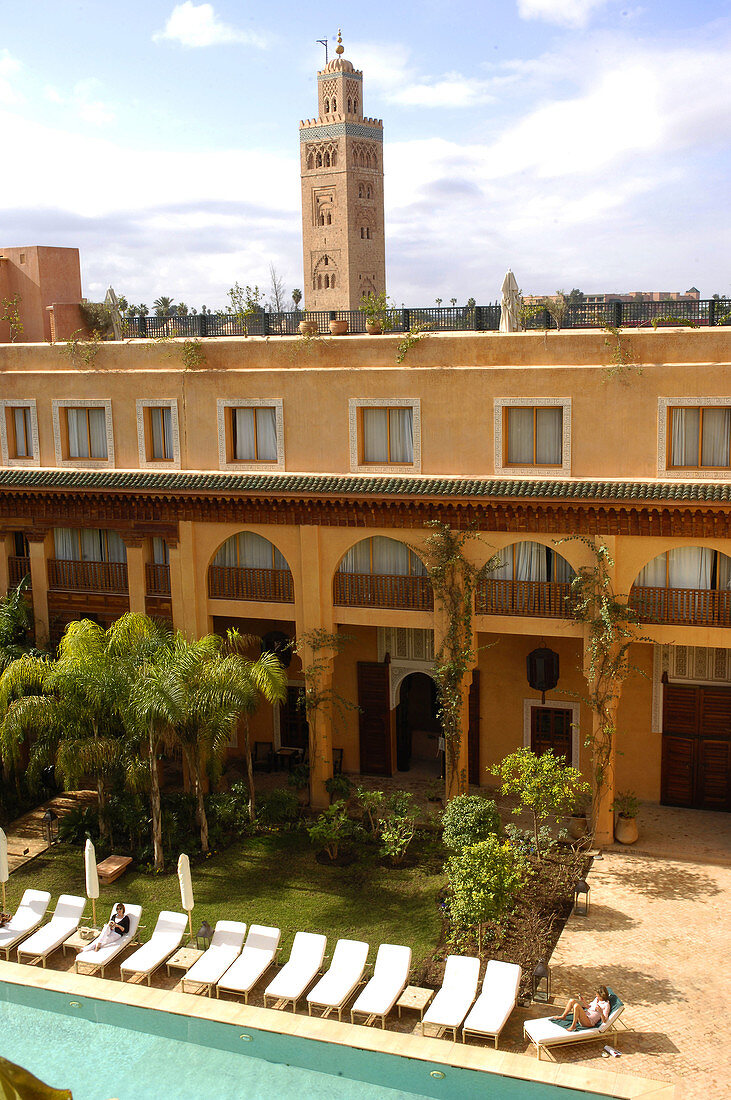 Jardins de la Koutoubia Hotel courtyard with Koutoubia at the back. Marrakech. Morocco.