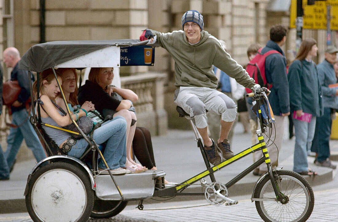 Tricycle taxi. Royal Mile. Edinburgh. Scotland. UK.