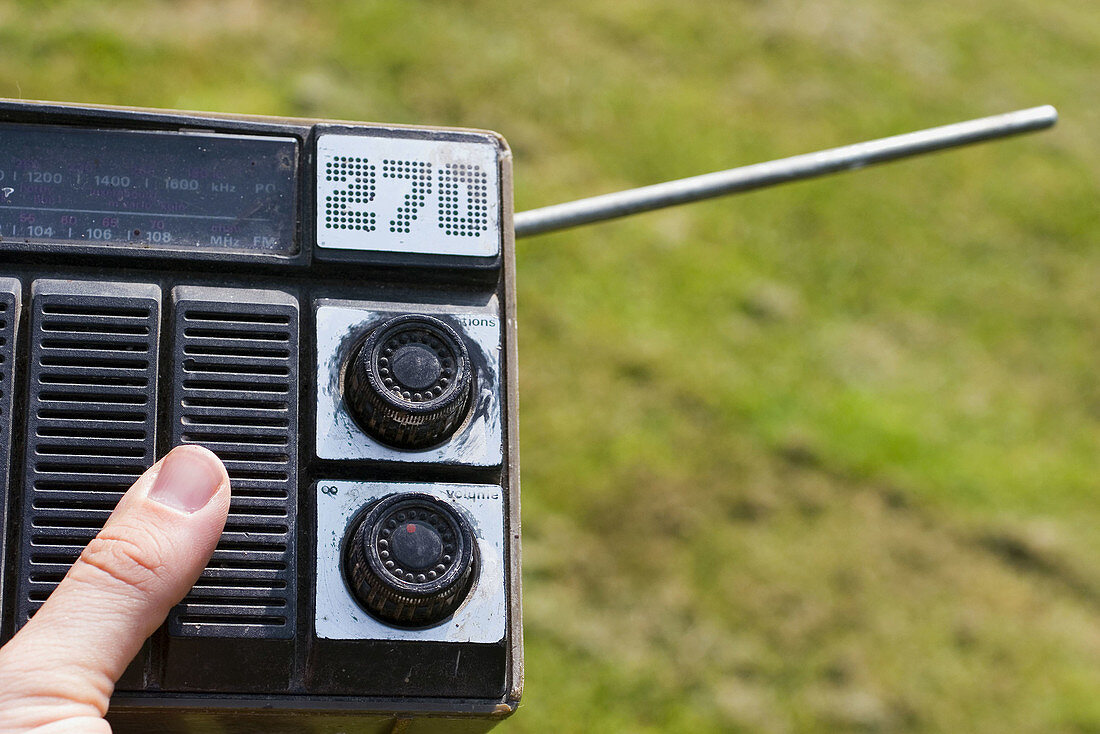 Old radio on the hand
