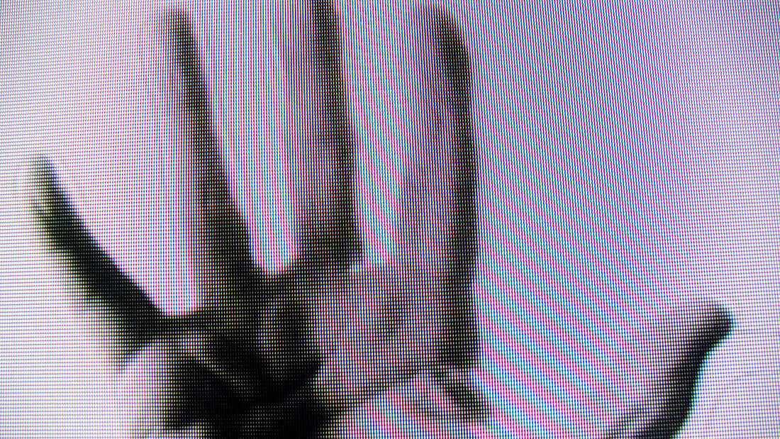 Hand on TV.