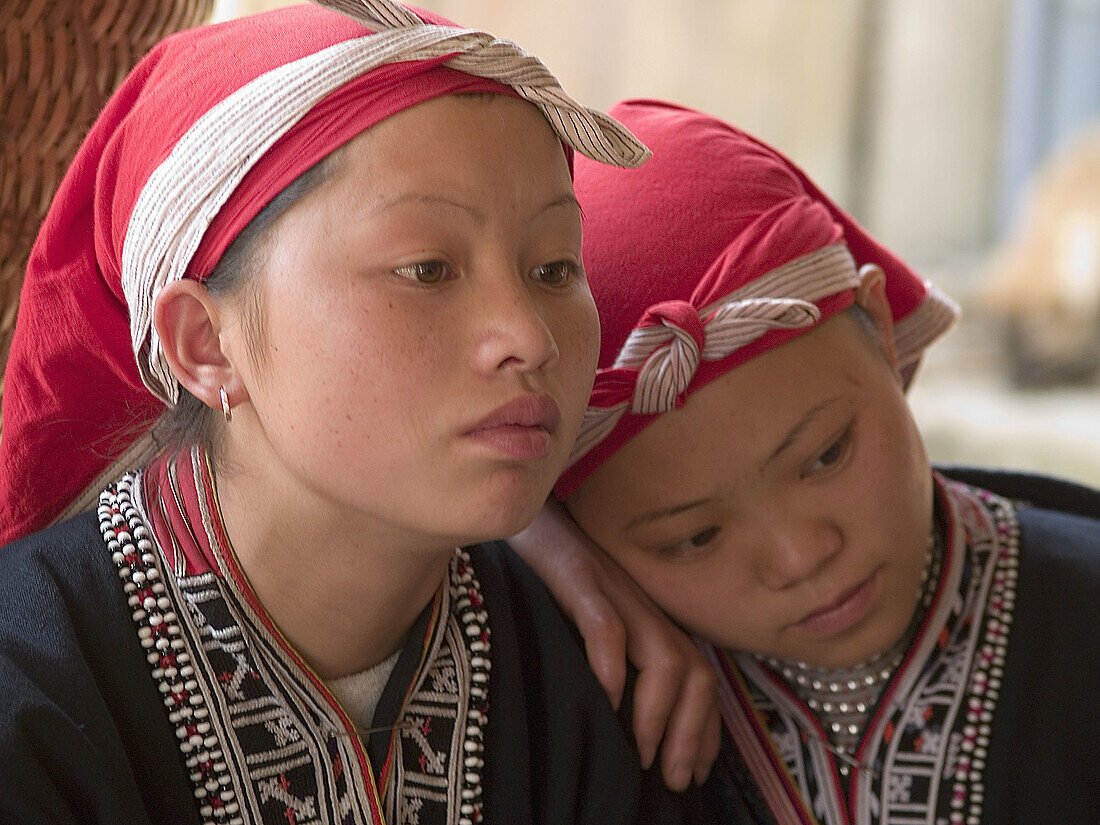 Two red Zao tribe teenagers reflecting. Ta Phin village, Vietnam (april 2006)