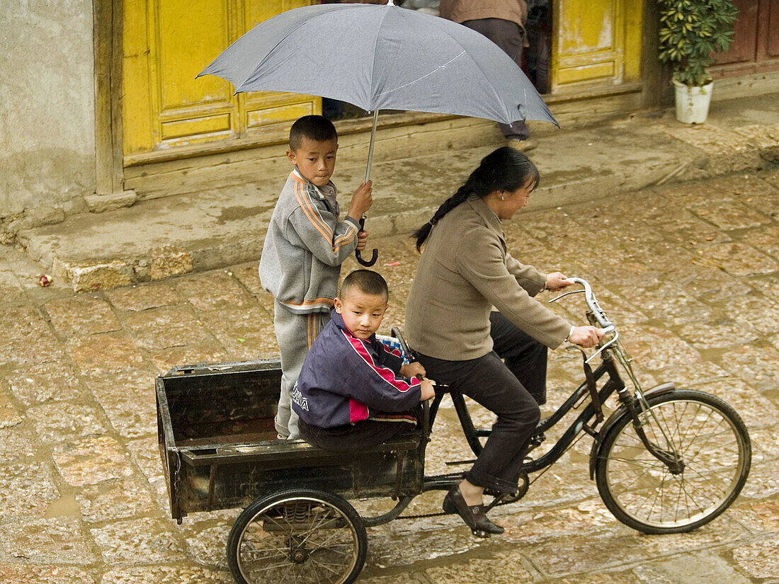 riding in the rain, Lijiang, China