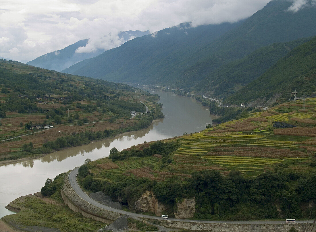 Yangtse River curves past farms and fields before entering Tiger Leaping Gorge, Yunnan, China
