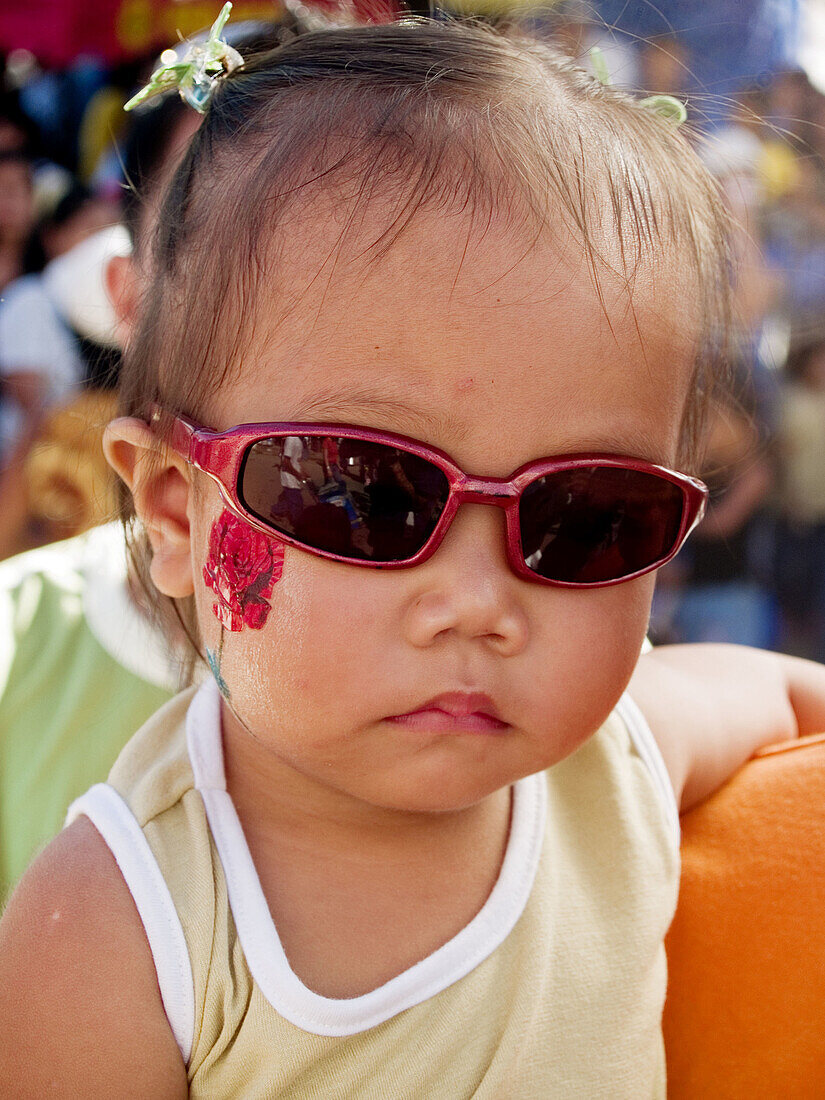 Little girl with big sunglasses, Ati Atihan Festival, Philippines