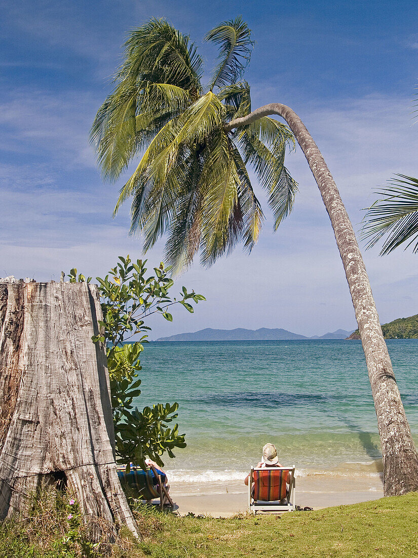 relaxing under a coconut palm, Koh Mak, Thailand