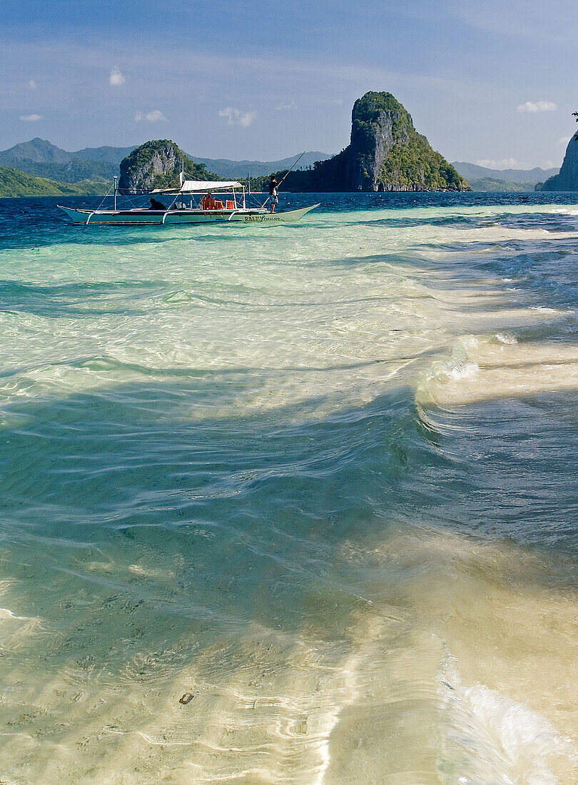 clear waters off the coast of Inabuyatan Island, Bacuit Archipelago, Palawan, Philippines