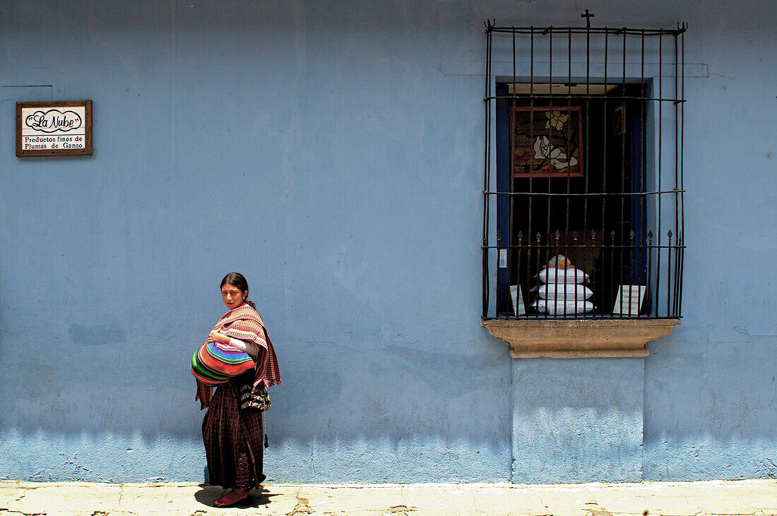 Maya woman with woven fabrics, Antigua, Guatemala, Central America