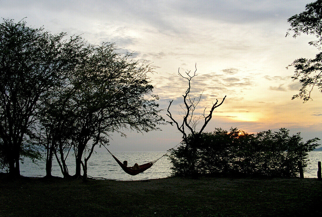 Person in a hammock at the beach near San Juan del Sur, Nicaragua, Central America