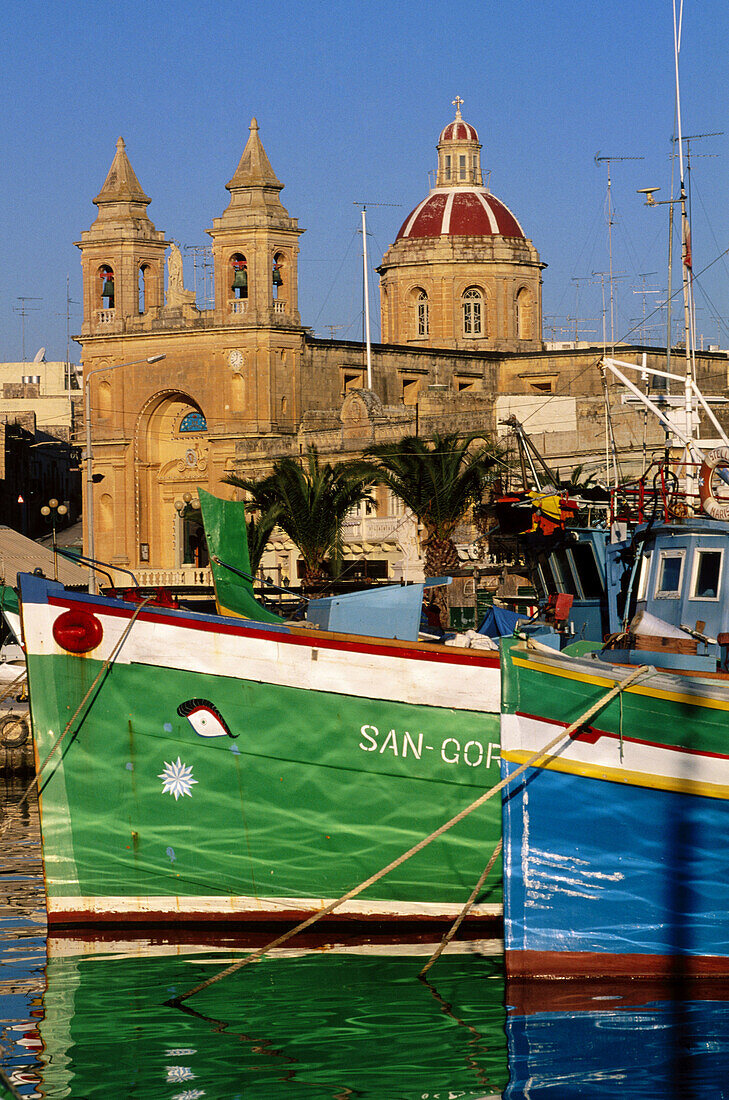 Luzzu boats anchored in Marsaxlokk harbour, Malta