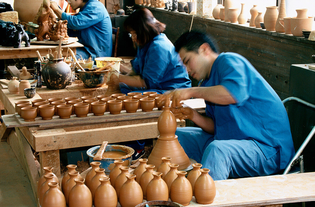 Traditional potters at work. Japan