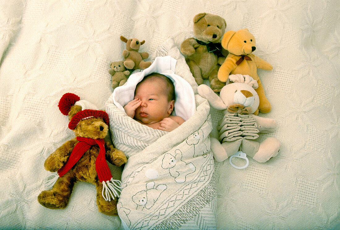 Child infant boy with bear toys