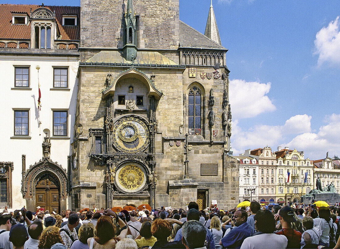 Crowd of tourists watching Astronomical Clock at Old Town Square in Prague, Czech Republic