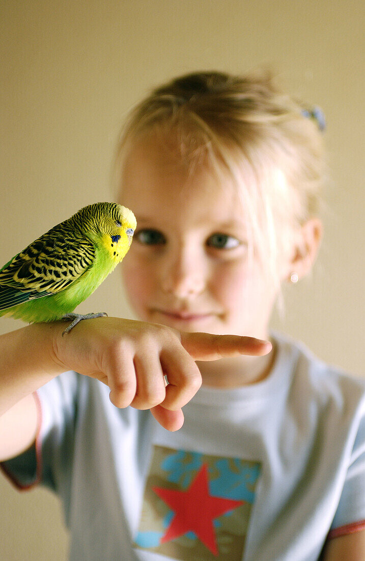 Children, Children only, Color, Colour, Contemporary, Facial expression, Facial expressions, Fair-haired, Female, Funny, Girl, Girls, Green, Grin, Grinning, Hand, Hands, Human, Indoor, Indoors, Insid