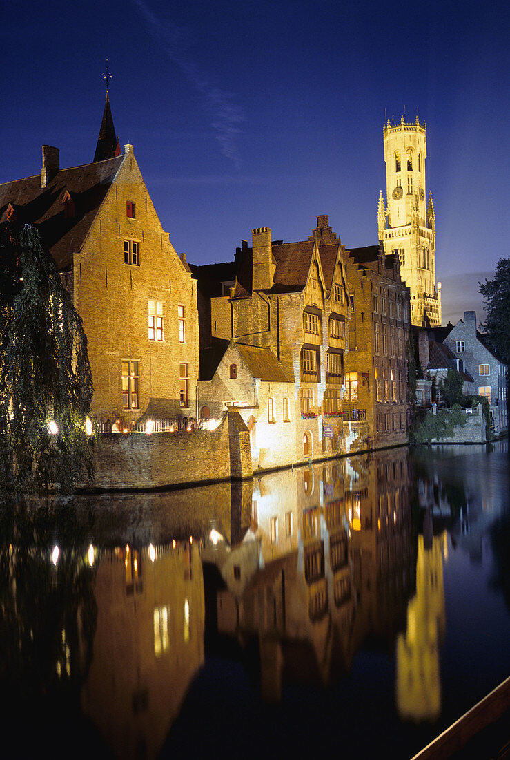 Canal scene with the Belfry in background. Brugge, Belgium
