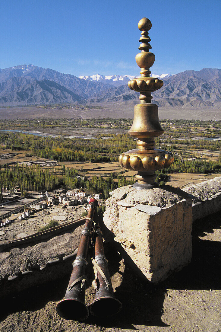 Tikse Gompa tibetan buddhist monastery, roof ornament, trumpets, scenery. Ladakh. Jammu & Kashmir. India.