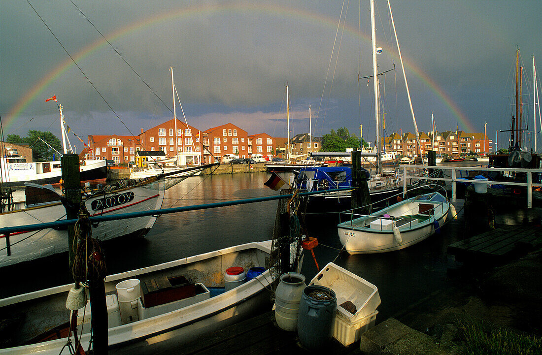 Rainbow over Orth harbour, Fehmarn island, Schleswig Holstein, Germany, Europe
