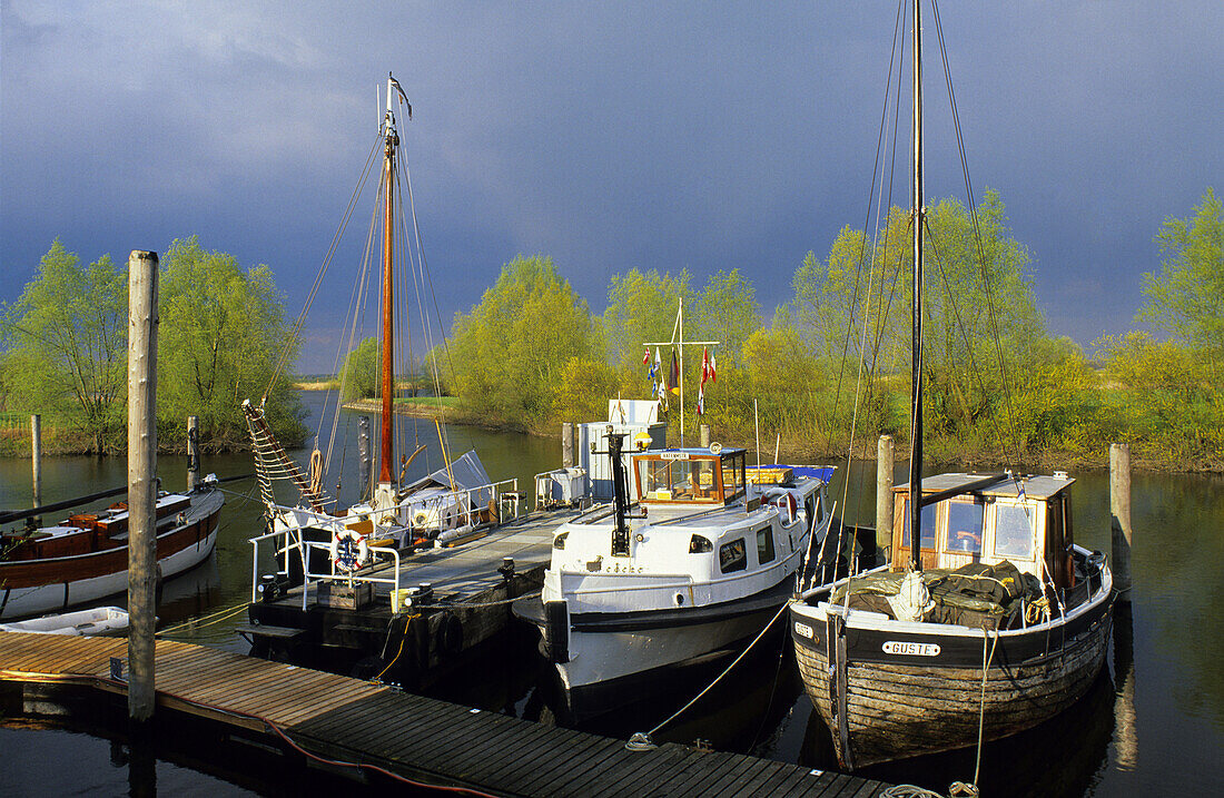 Boats at a jetty on the river Elbe, Lower Saxony, Germay