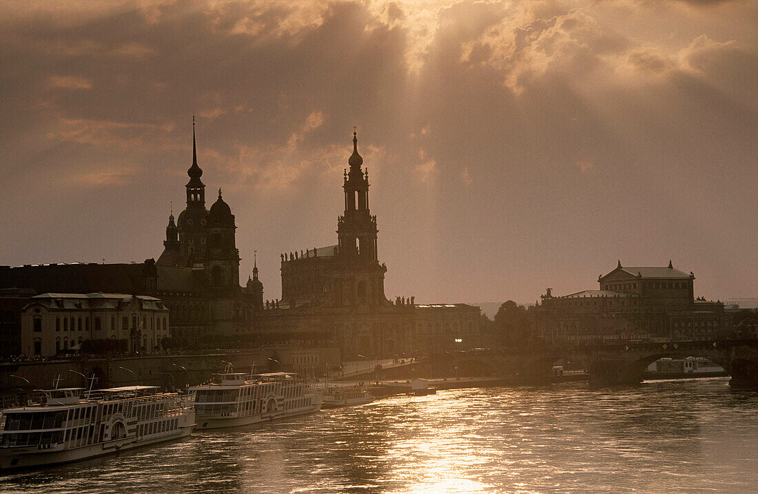 Europe, Germany, Saxony, Dresden, Skyline of Dresden with Brühlsche terrace, Residenzschloss, Ständehaus, Haussman Tower and Catholic Court Church and Semper Opera seen from Carola bridge on Elbe River