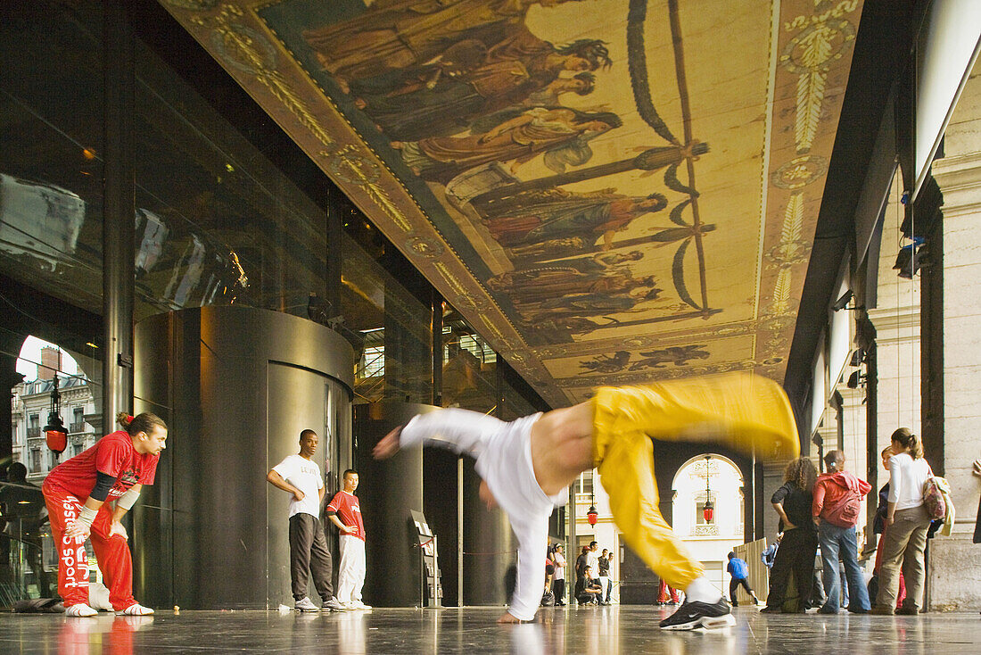 Break dance under the arcades of the Opera, Lyon. Rhône-Alpes, France