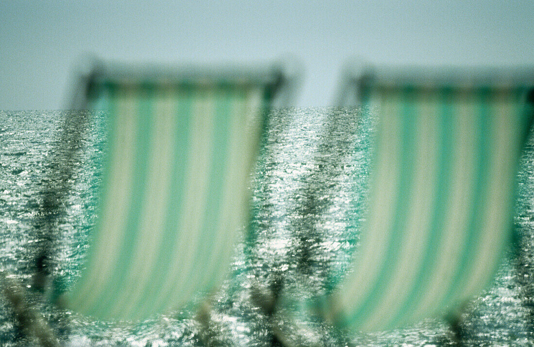 Beach, Beach chair, Beach chairs, Beaches, Blurred, Calm, Calmness, Chill out, Chilling out, Color, Colour, Concept, Concepts, Contemporary, Daytime, Deck chair, Deckchair, Empty, Exterior, Green, Holiday, Holidays, Horizontal, Leisure, Nobody, Object, Ob