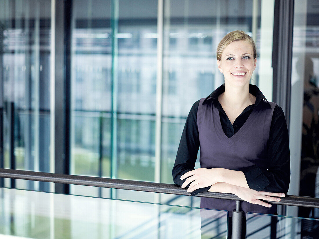 Businesswoman smiling at camera, Munich, Bavaria, Germany